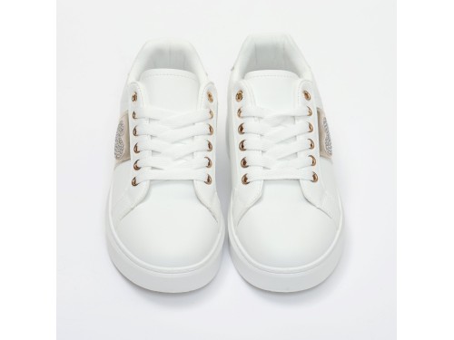 Sneakers in simil pelle con ricamo laterale