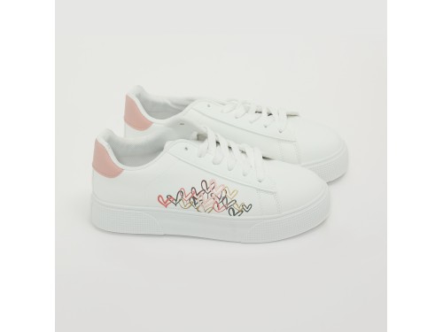 Sneakers in simil pelle con ricamo laterale