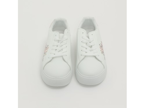 Sneakers in simil pelle con ricamo laterale